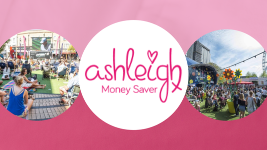 Pink banner with "Ashleigh Money Saver" logo, outdoor crowd watching a screen on the left, busy festival scene on the right.