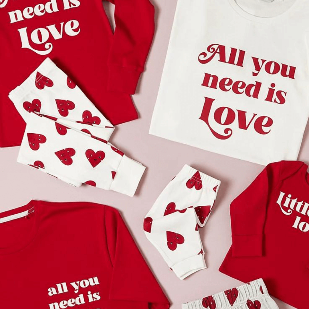 Valentine's Day pyjamas in different sizes. Pink and red hues.
